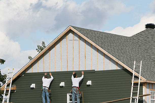 Professional Siding technician working in Leasburg, NC
